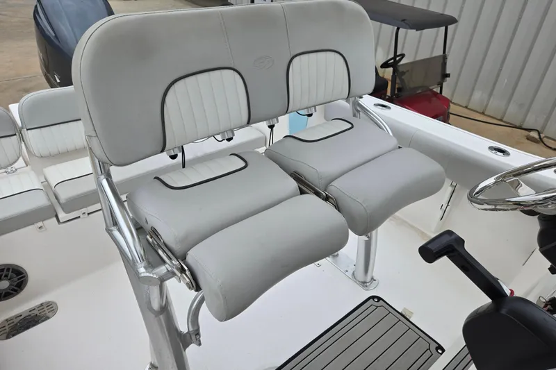 Slide: The Image of 2023 Sea Fox 228 Commander boat seating and helm area, featuring comfortable dual seats. - 9