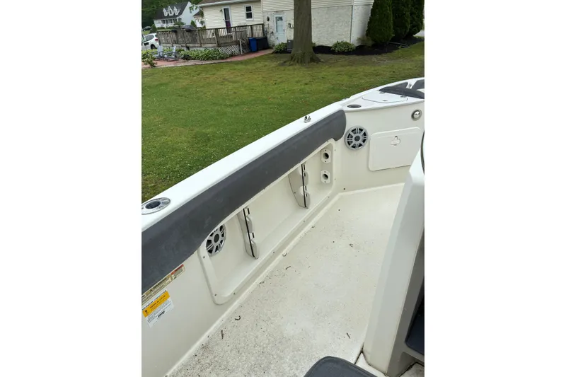 Slide: The Image of 2017 Stingray 206 CC boat interior with speakers and storage compartments. - 9