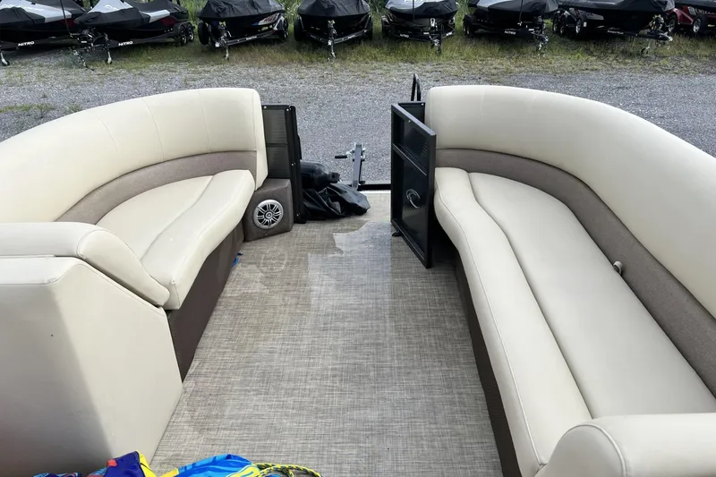 Slide: The Image of Interior of a 2016 Crest I 220 pontoon boat with beige seating. - 6
