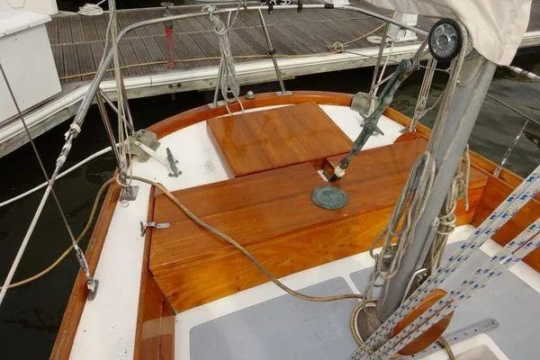 Slide: The Image of 1964 Hinkley Bermuda 40 sailboat deck with wooden finish and rigging. - 14