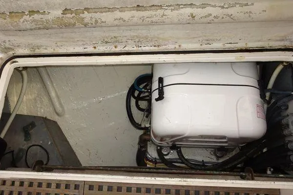 Slide: The Image of Engine compartment of a 1964 Hinkley Bermuda 40 sailboat, showing mechanical components. - 30