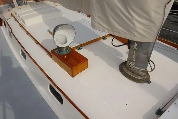 Slide: The Image of 1964 Hinkley Bermuda 40 sailboat deck with wooden accents and ventilation feature. - 6