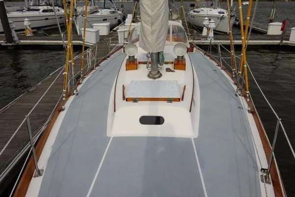 Slide: The Image of 1964 Hinkley Bermuda 40 sailboat deck view at marina. - 8