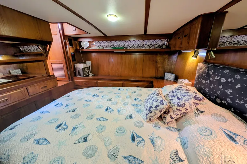Slide: The Image of 1989 President 37 Double Cabin bedroom with nautical-themed bedding and wooden interior. - 17