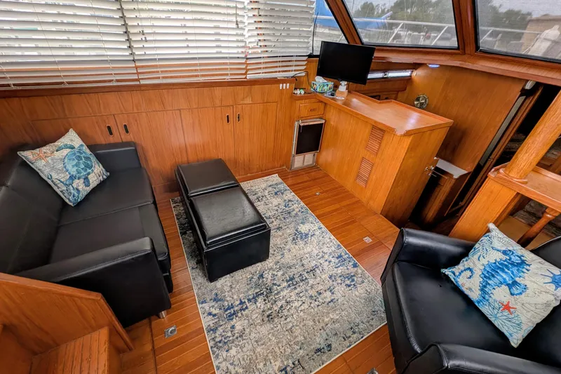 Slide: The Image of Luxurious interior of 1989 President 37 Double Cabin yacht with elegant seating and decor. - 6