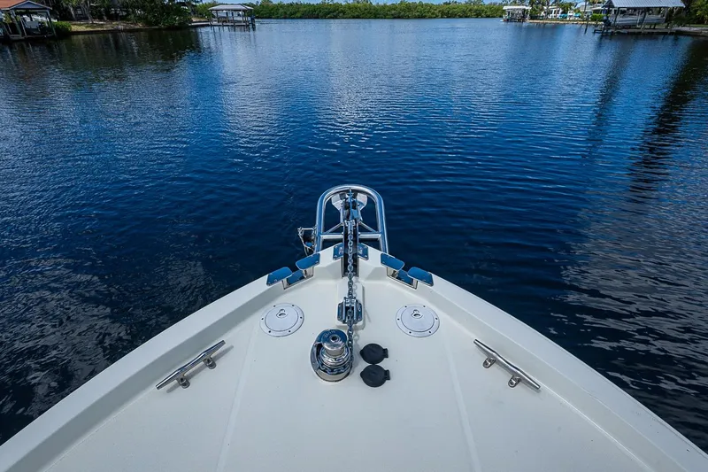 Slide: The Image of Bow view of 2002 True North 38 boat on calm water. - 13