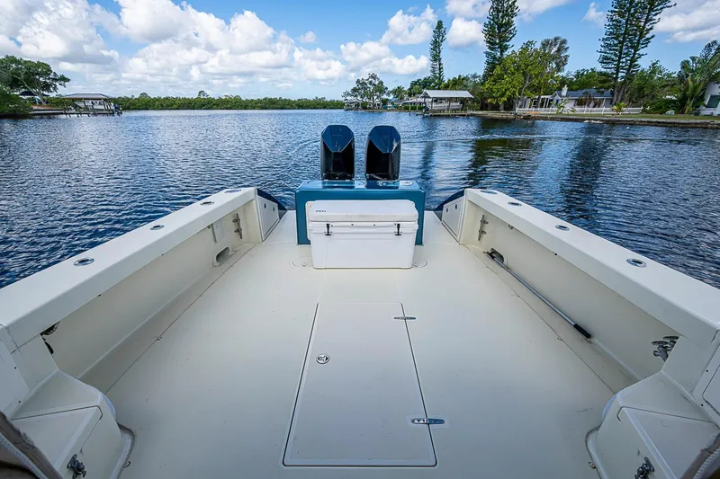 Slide: The Image of 2002 True North 38 boat deck overlooking serene lake with clear blue skies. - 15