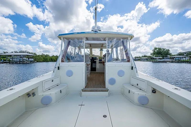 Slide: The Image of 2002 True North 38 boat on calm water under a partly cloudy sky. - 19