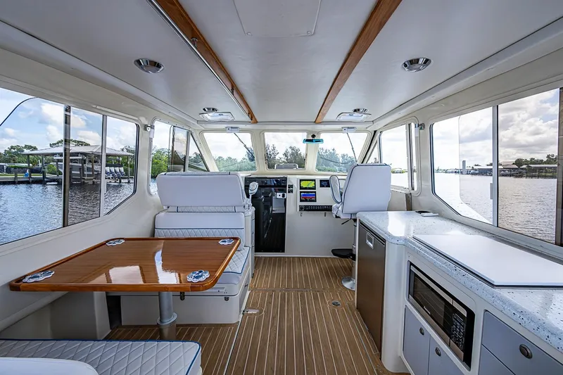 Slide: The Image of Interior of a 2002 True North 38 boat with modern amenities and scenic water views. - 20