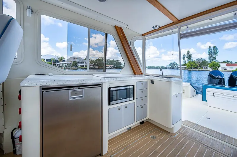 Slide: The Image of Interior of 2002 True North 38 boat with kitchenette and scenic water view. - 22