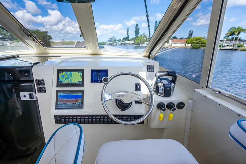 Slide: The Image of Helm of 2002 True North 38 boat with navigation screens and steering wheel. - 26
