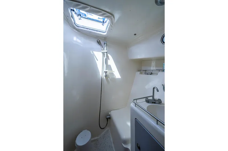 Slide: The Image of Compact boat bathroom with shower and sink, True North 38, 2002 model. - 35