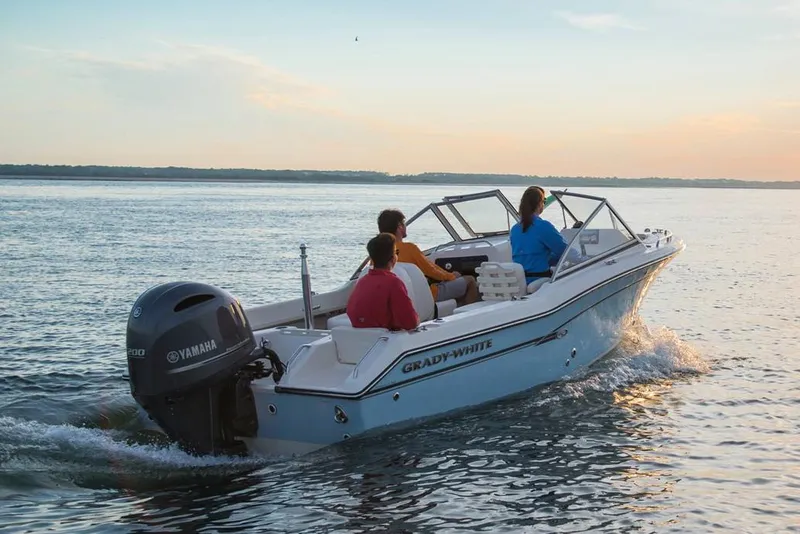 Slide: The Image of Manufacturer Provided Image: 2019 Grady-White Freedom 192 boat cruising on open water at sunset. - 3