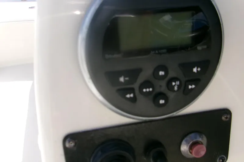 Slide: The Image of Control panel of a 2018 Stingray 182 SC boat with buttons and display. - 11