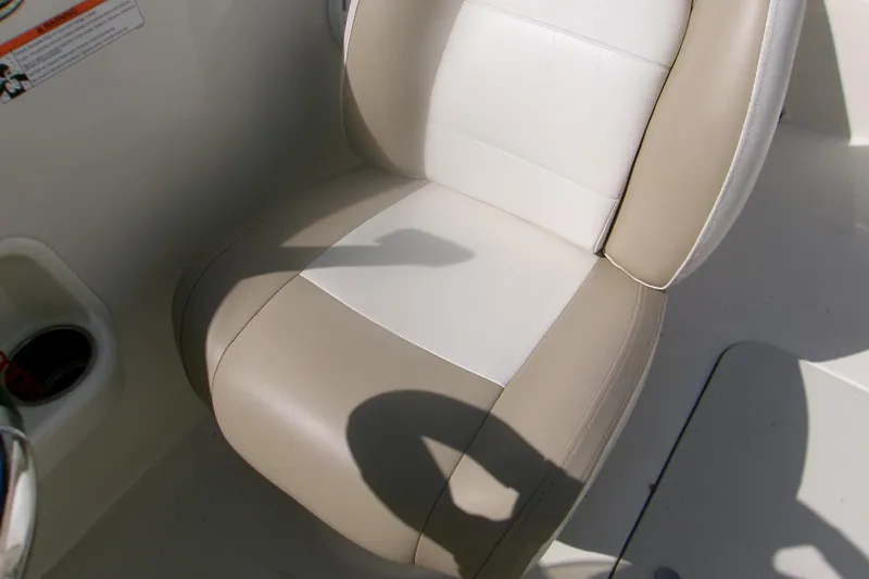Slide: The Image of 2018 Stingray 182 SC boat seat with beige and white upholstery. - 9