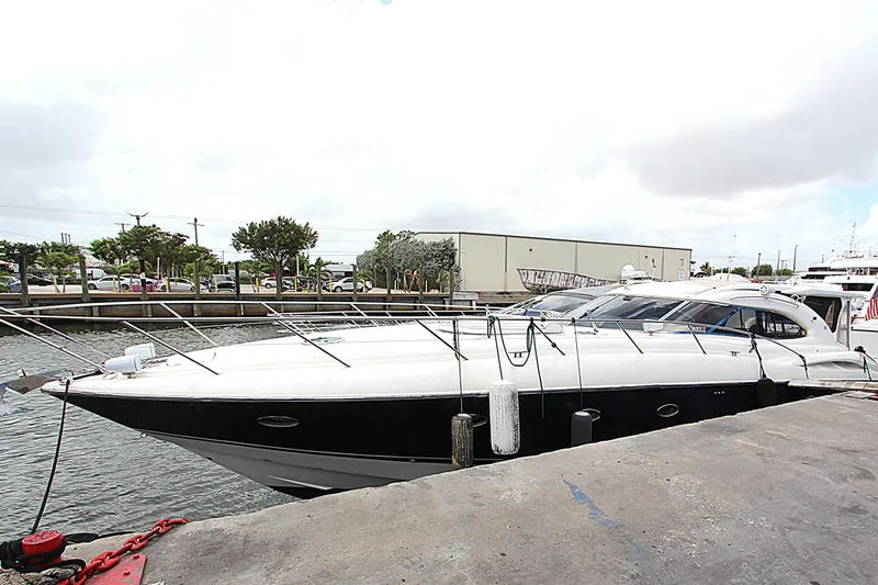 The Image of 2001 Sunseeker Predator 56 yacht docked at marina, showcasing sleek design and luxury features. - 0