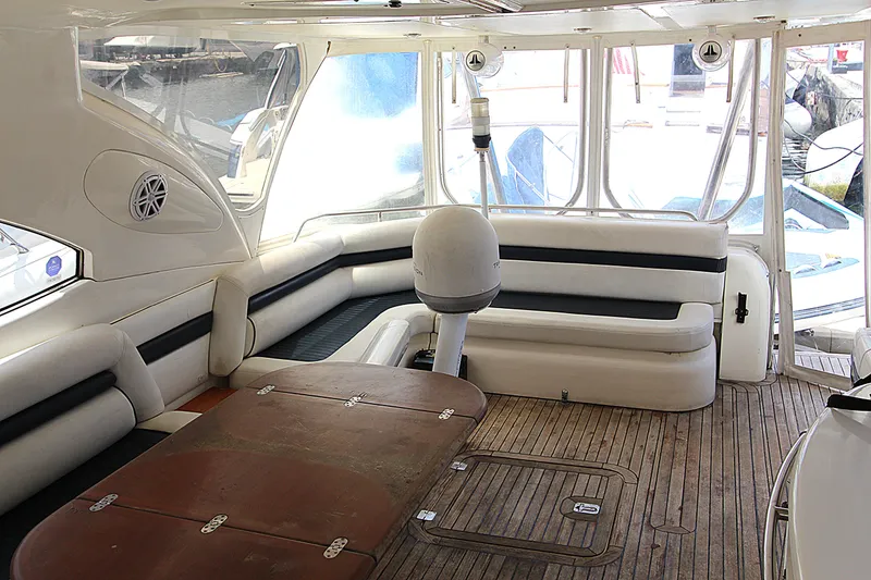 Slide: The Image of Luxurious interior of 2001 Sunseeker Predator 56 yacht with elegant seating and wooden flooring. - 5