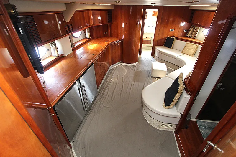 Slide: The Image of Luxurious interior of a 2001 Sunseeker Predator 56 yacht with elegant wood finishes. - 8