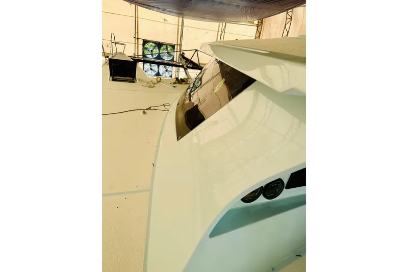 Slide: The Image of Sleek Alibi 54 yacht interior under construction, showcasing modern design elements, 2011 model. - 13