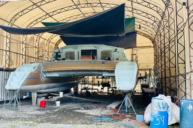 Slide: The Image of Catamaran Alibi 54 under construction in a covered workshop, 2011 model. - 14