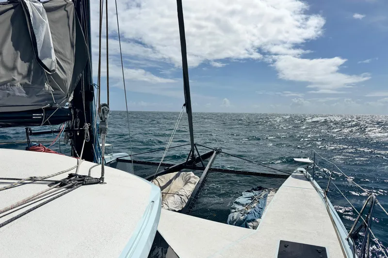 Slide: The Image of Sailing on Alibi 54 catamaran, 2011 model, under clear skies and calm ocean. - 2