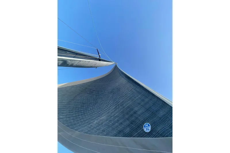 Slide: The Image of Sailboat mast and sail against clear blue sky, Alibi 54, 2011 model. - 28