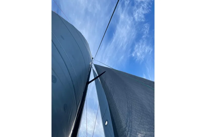Slide: The Image of Sailboat mast and sails against a blue sky, Alibi 54, 2011 model. - 3