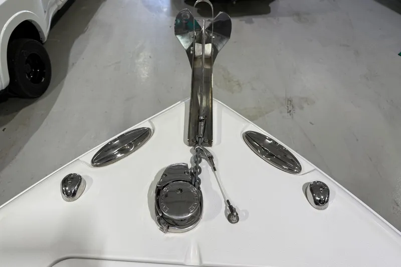 Slide: The Image of 2016 Sea Hunt Gamefish 25 boat anchor and deck fittings in a showroom. - 15