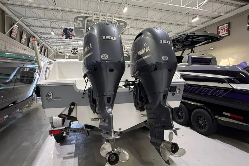 Slide: The Image of 2016 Sea Hunt Gamefish 25 with twin Yamaha 150 engines in showroom. - 2