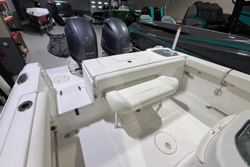 Slide: The Image of 2016 Sea Hunt Gamefish 25 boat interior with dual Yamaha 150 engines. - 3