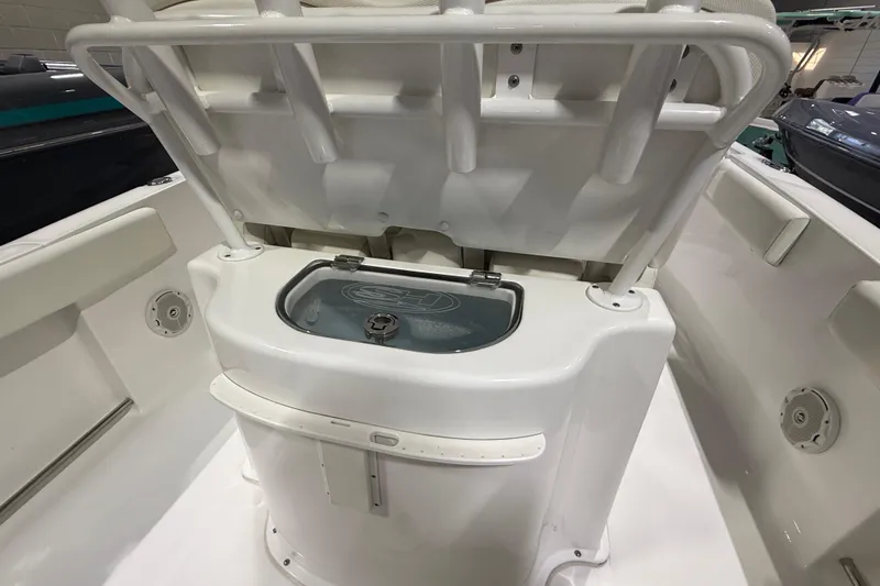 Slide: The Image of 2016 Sea Hunt Gamefish 25 boat interior with open storage compartment. - 4