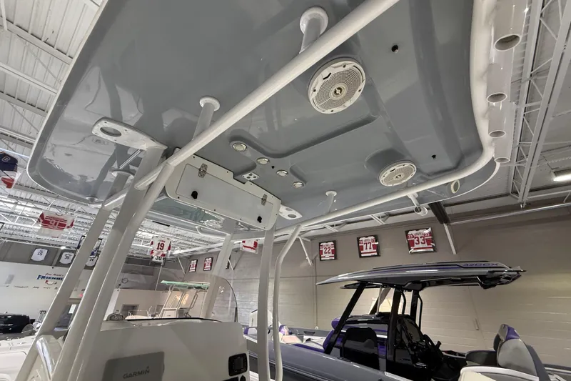 Slide: The Image of 2016 Sea Hunt Gamefish 25 boat interior with overhead speakers and equipment. - 7