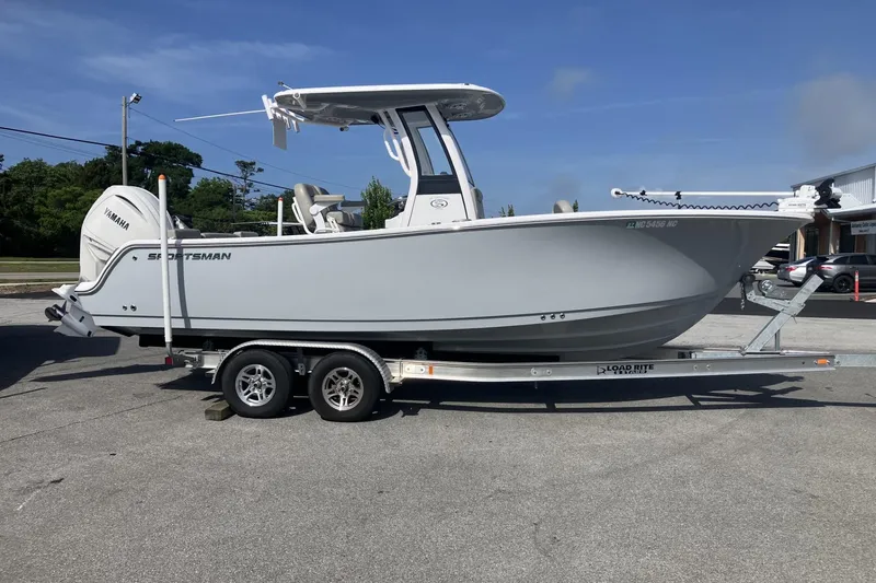 The Image of 2024 Sportsman Heritage 231 Center Console boat on trailer, side view. - 0