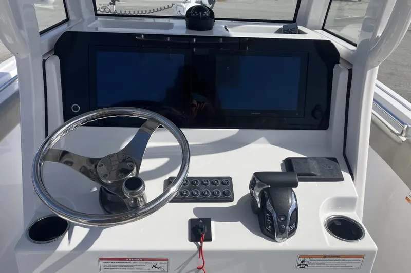 Slide: The Image of 2024 Sportsman Heritage 231 Center Console dashboard with steering wheel and controls. - 11
