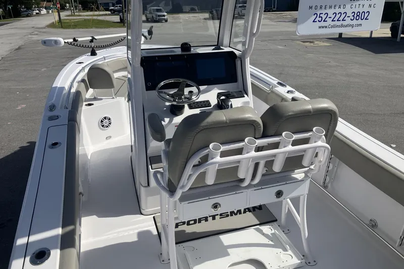 Slide: The Image of 2024 Sportsman Heritage 231 Center Console boat interior with steering wheel and seating. - 14