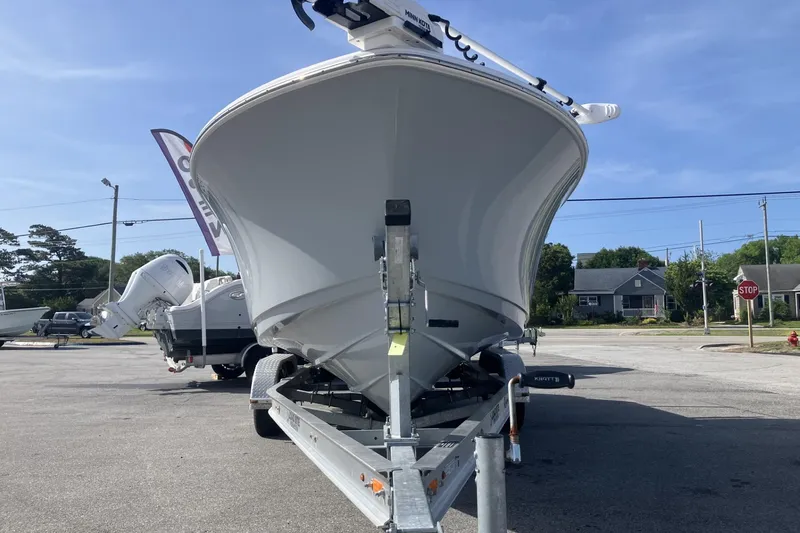 Slide: The Image of 2024 Sportsman Heritage 231 Center Console boat on trailer, outdoor display. - 3