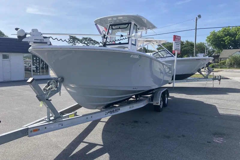 Slide: The Image of 2024 Sportsman Heritage 231 Center Console boat on trailer, displayed for sale. - 4