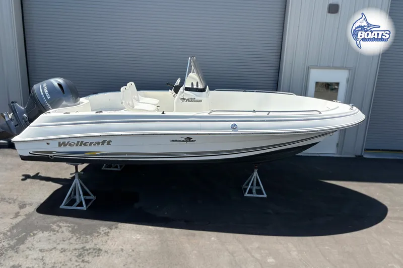 The Image of 2004 Wellcraft 180 Fisherman boat on stands, featuring Yamaha outboard motor. - 0