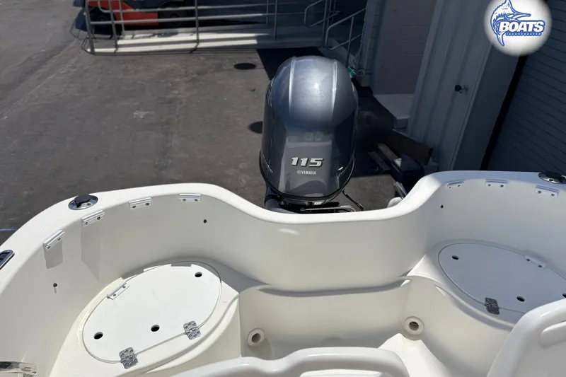 Slide: The Image of 2004 Wellcraft 180 Fisherman boat with Yamaha 115 engine, docked outdoors. - 11