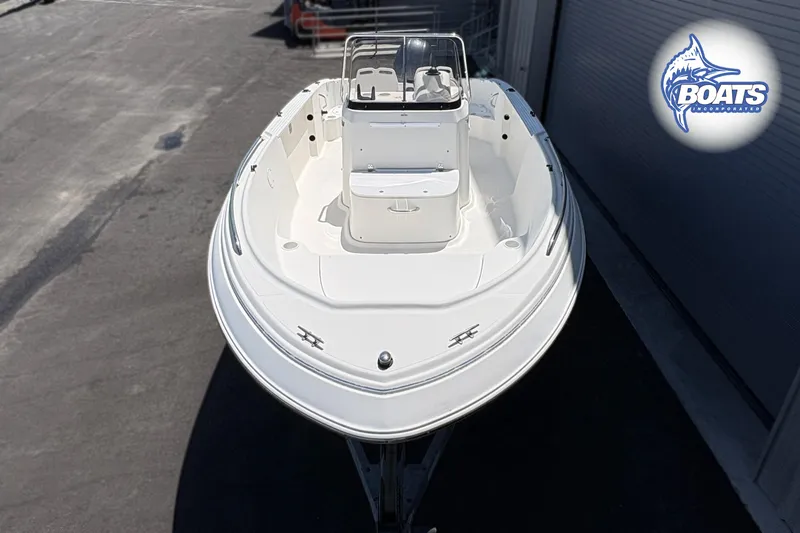 Slide: The Image of 2004 Wellcraft 180 Fisherman boat, white exterior, docked at marina. - 2