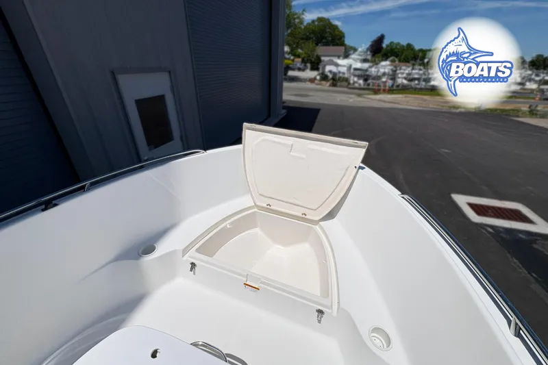 Slide: The Image of 2004 Wellcraft 180 Fisherman boat with open storage compartment on deck. - 4