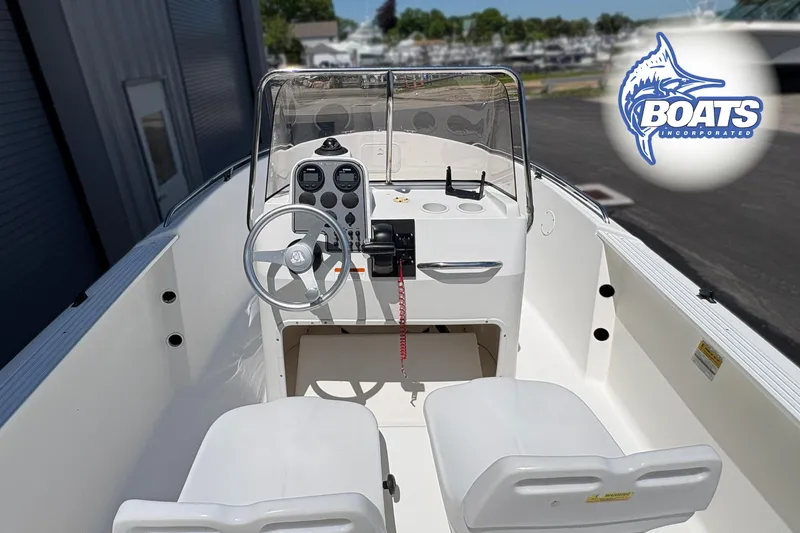 Slide: The Image of 2004 Wellcraft 180 Fisherman boat interior with steering console and seating. - 7