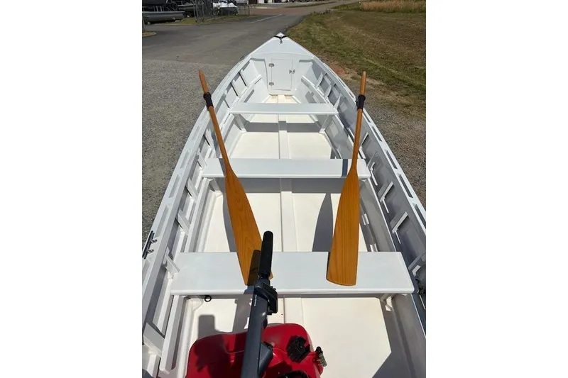 Slide: The Image of 2006 Homebuilt V-HULL boat interior with wooden oars and seating. - 4