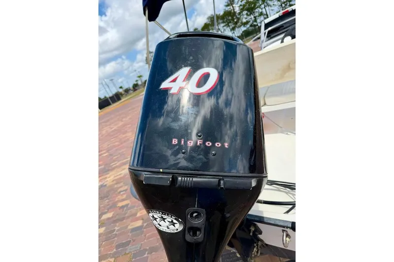 Slide: The Image of Outboard motor on a 2002 Boston Whaler 130 Sport boat, featuring "BigFoot" and "40" labels. - 5
