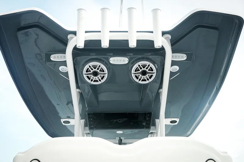 Slide: The Image of 2026 Tidewater 282 CC Adventure boat's overhead view with speakers and rod holders. - 15
