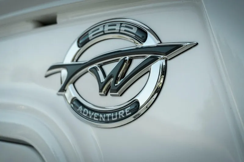 Slide: The Image of Chrome emblem of 2026 Tidewater 282 CC Adventure boat. - 18