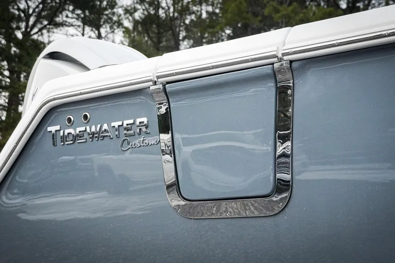 Slide: The Image of 2026 Tidewater 282 CC Adventure boat with custom detailing and sleek design. - 23