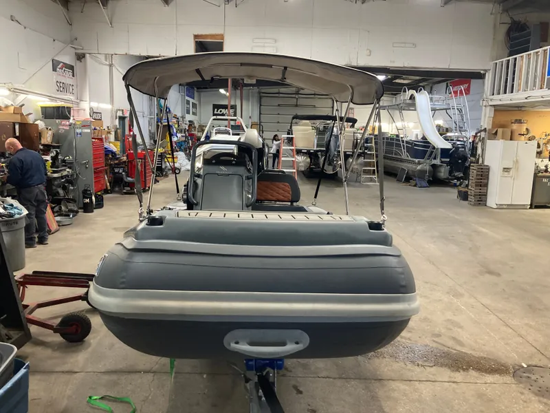 Slide: The Image of 2023 Highfield Sport 360 boat in a workshop. - 4