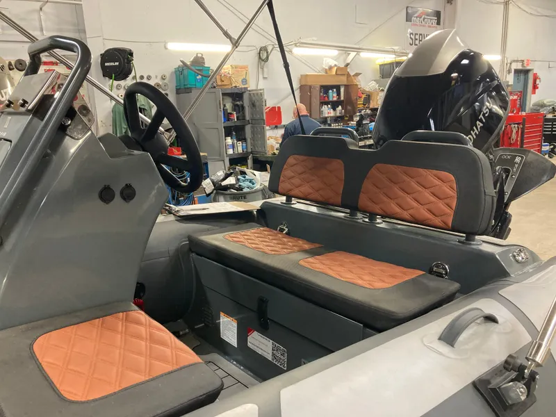 Slide: The Image of Interior of a 2023 Highfield Sport 360 boat with leather seats. - 7