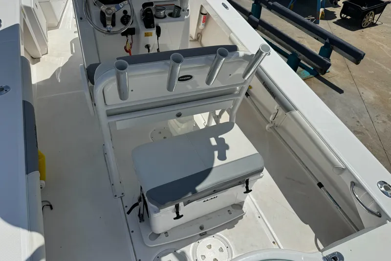 Slide: The Image of 2017 Everglades 243 Center Console boat interior with seating and rod holders. - 10